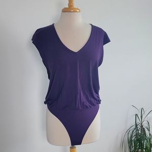 Side-cut purple bodysuit